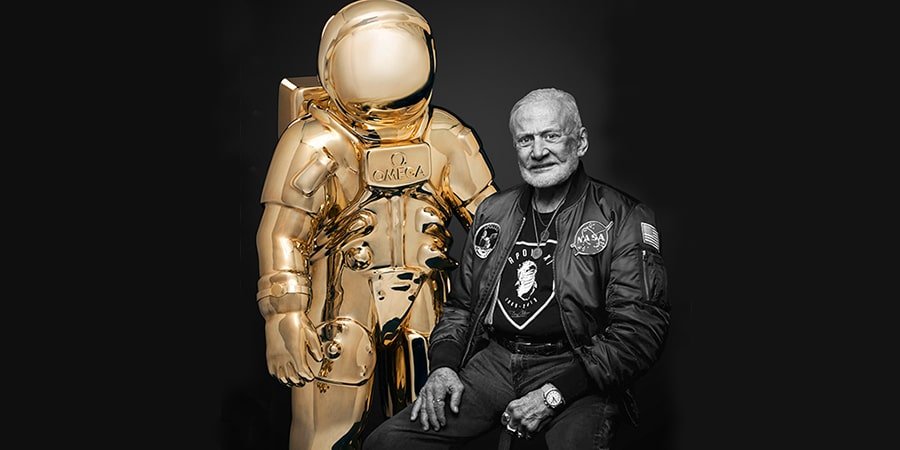 astronaut Buzz Aldrin with a golden astronaut Swimmer Chad Le Clos and an astronaut at Omegas Apollo 11 50th anniversary