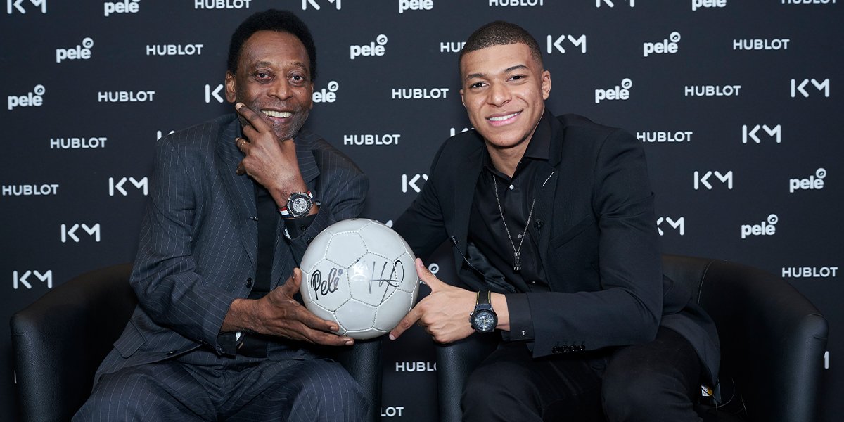Pelé and Mbappé with a signed soccer ball cover
